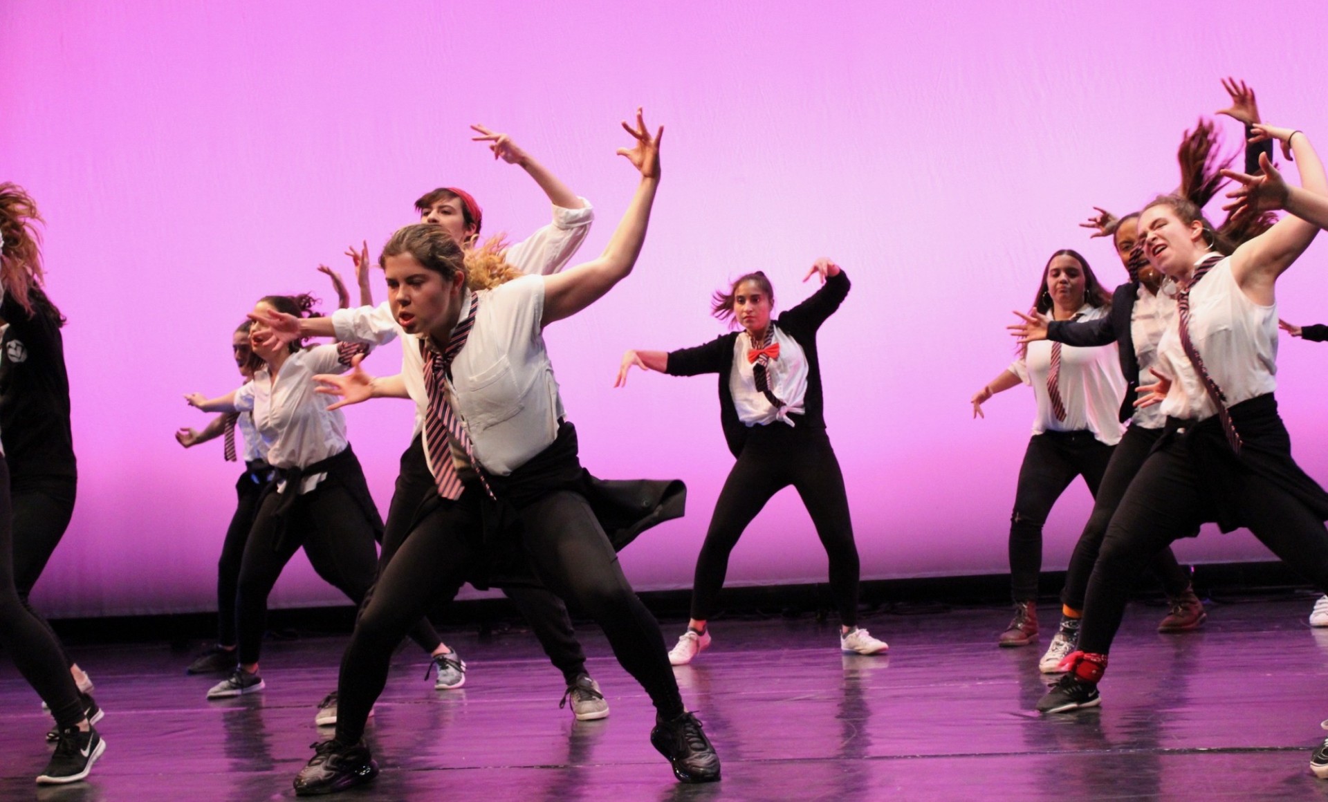 Dancers from our Spring 2019 show performing choreography by Yaël Cohen onstage.