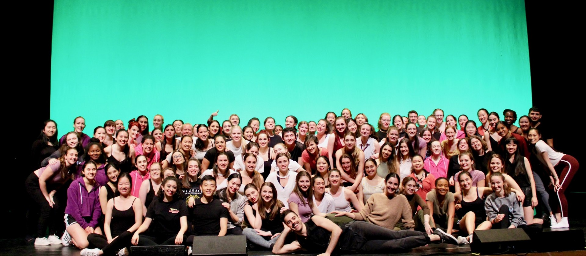Group photo onstage of the entire 150-person cast of our Spring 2019 performance.