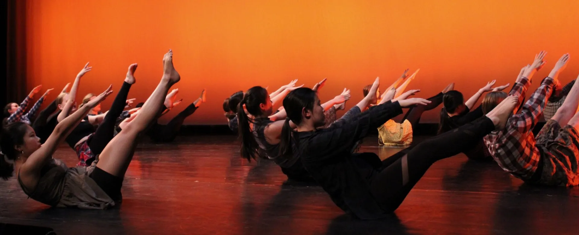 Dancers from our Spring 2019 show performing choreography by Marya Merriam onstage.