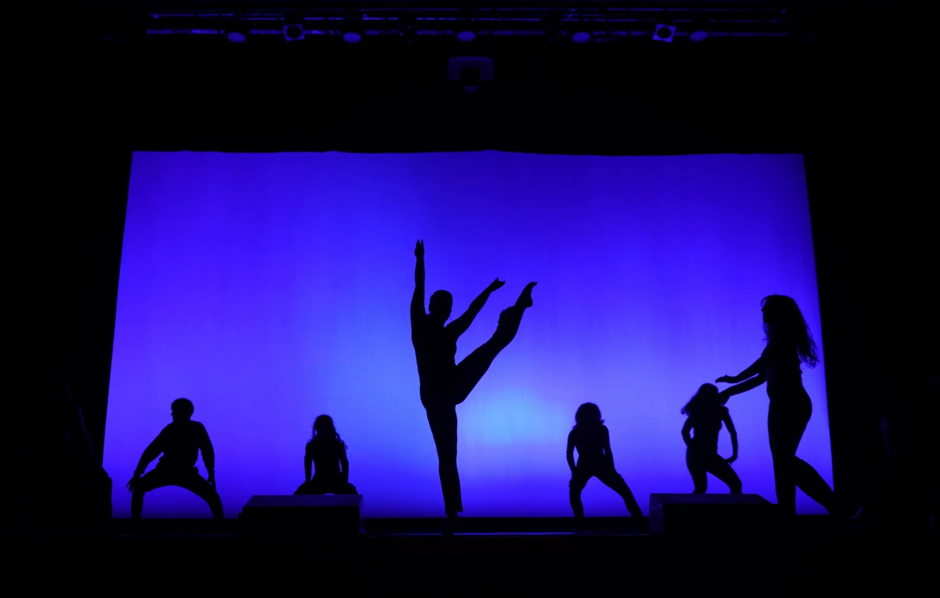 Dancers from our Fall 2023 show performing choreography by Alexis Ishmael onstage.